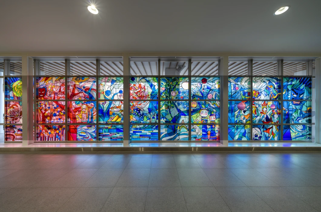 Full view of the stained glass artwork “To the Deep Blue Forests”