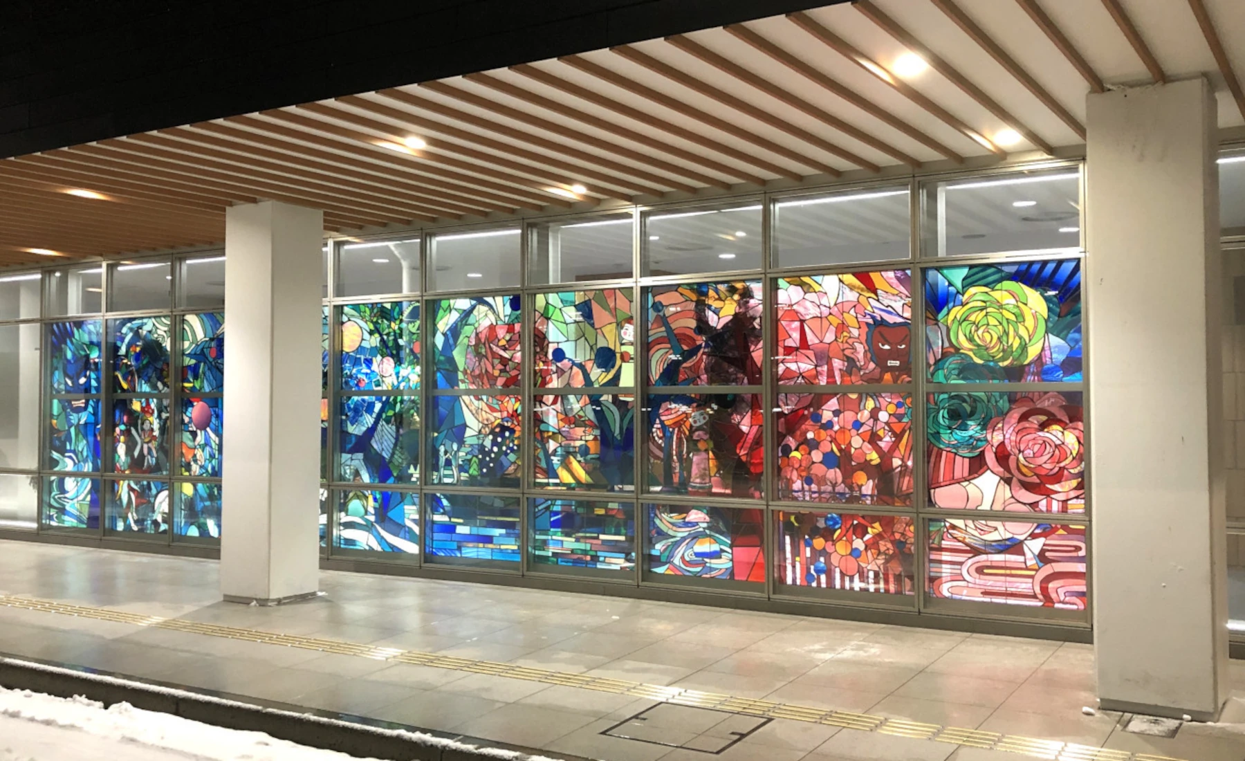 Full view of the stained glass artwork “To the Deep Blue Forests”