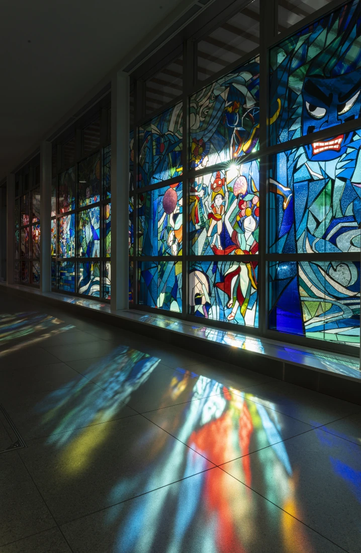 Detail of the stained glass artwork “To the Deep Blue Forests”