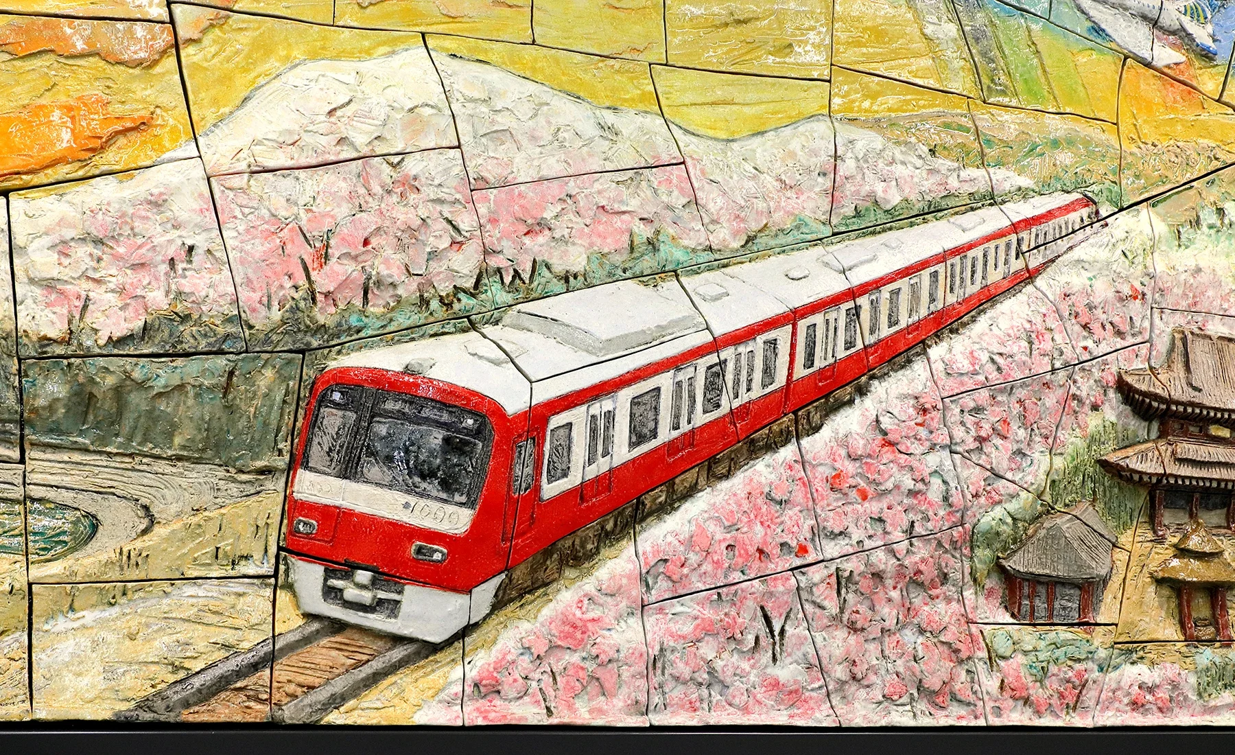Close-up of the Ceramic Relief artwork “Sparkling Hope, KEIKYU”
