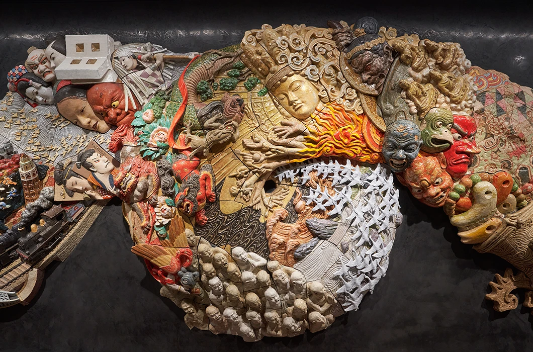 Close-up of the central section of the ceramic relief artwork “Procession Spin”.