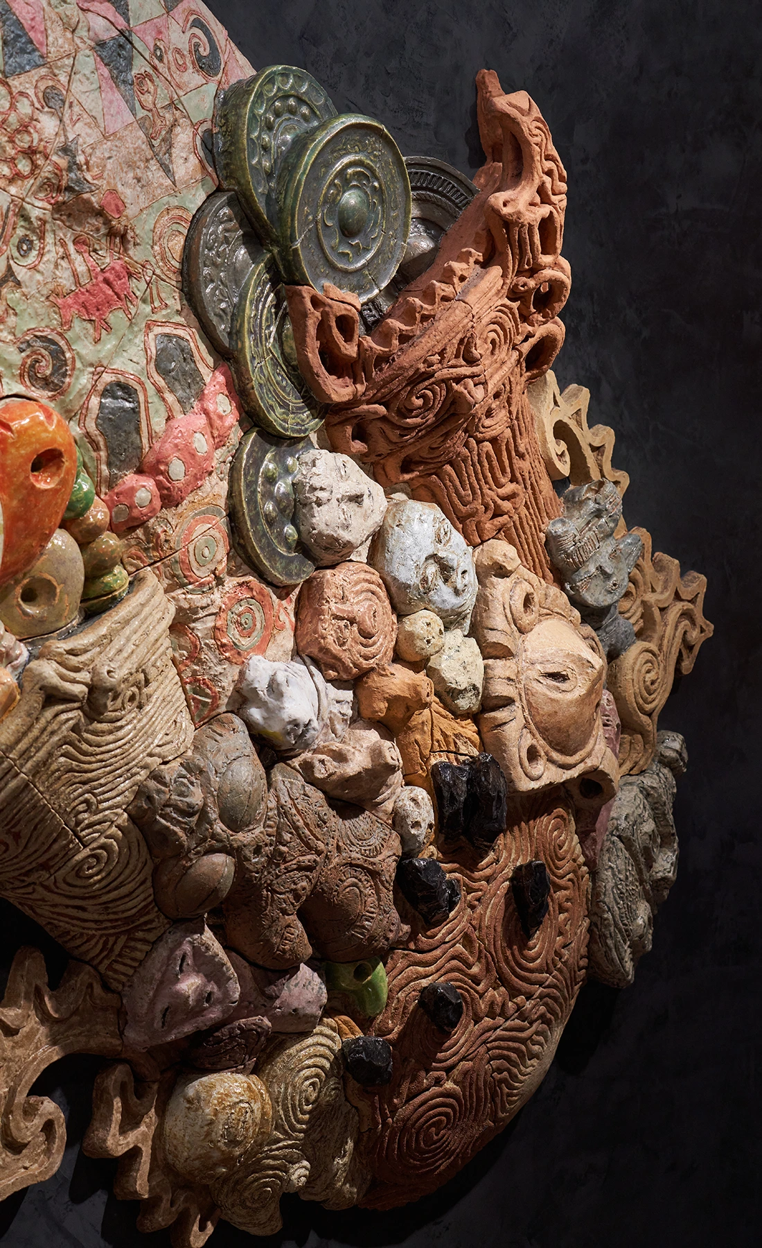 Detail of the ceramic relief artwork “Procession Spin”