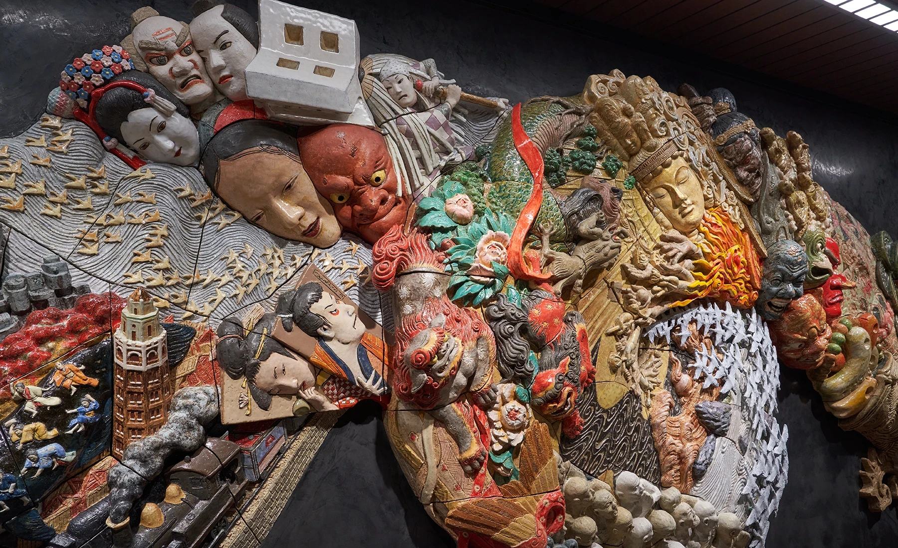Detail of the ceramic relief artwork “Procession Spin”