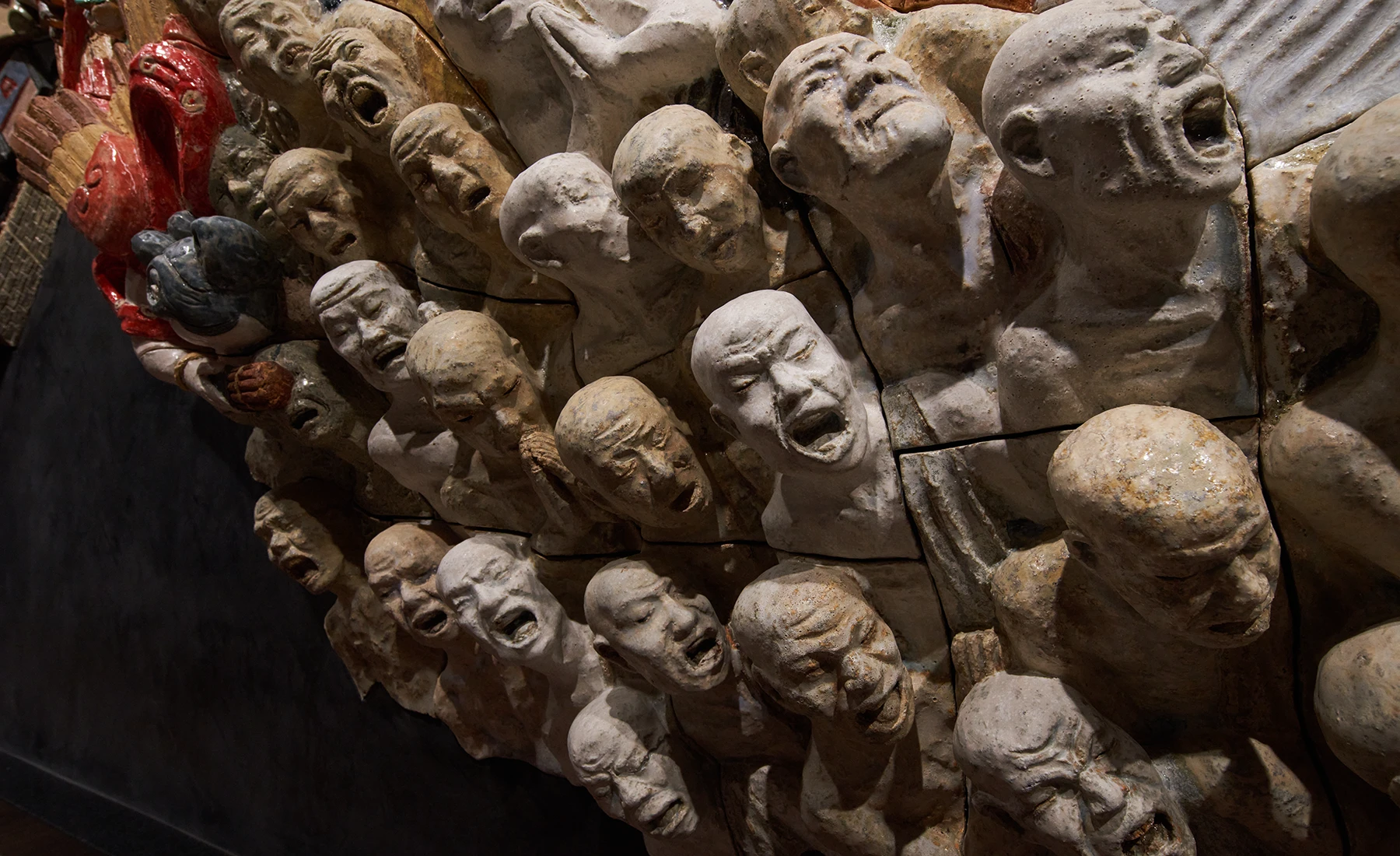 Detail of the ceramic relief artwork “Procession Spin”