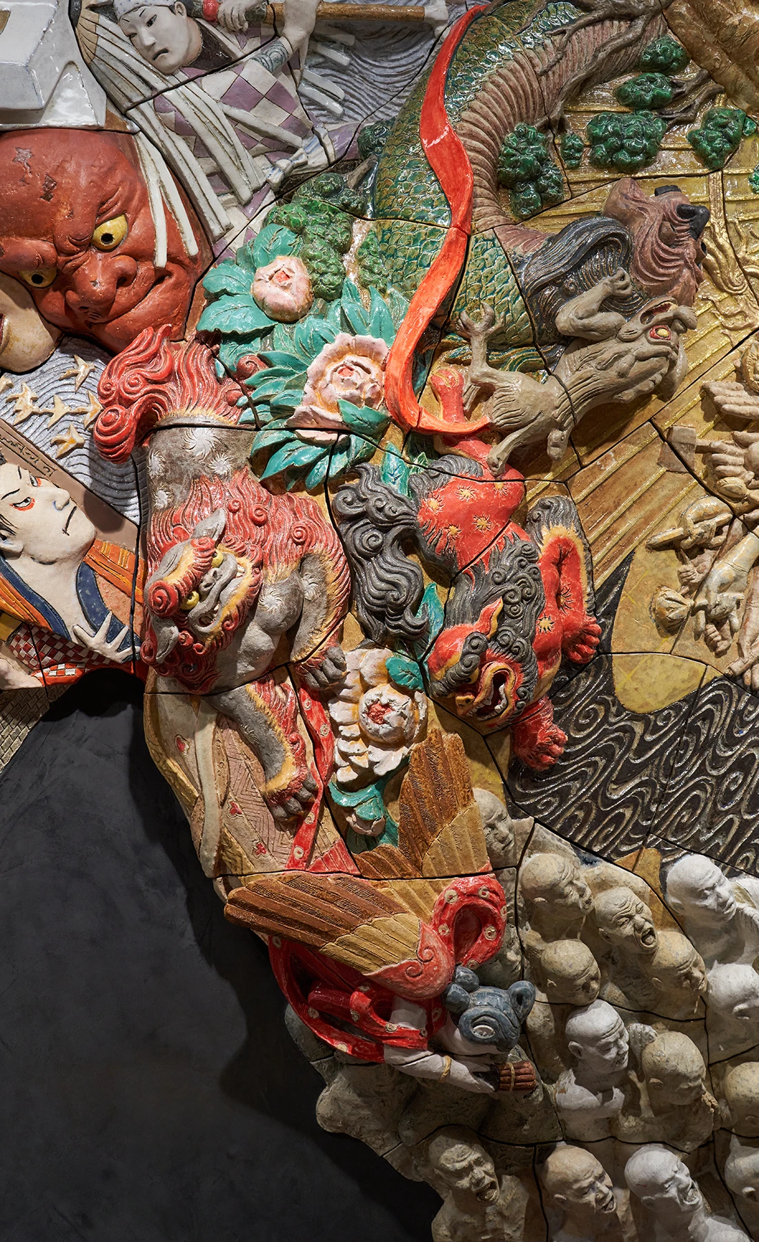 Detail of the ceramic relief artwork “Procession Spin”