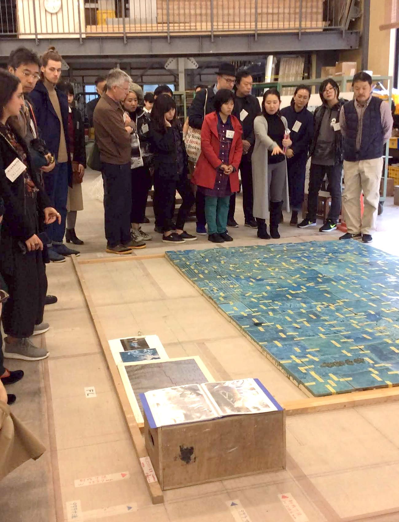Students learning about large-scale art in an active production environment