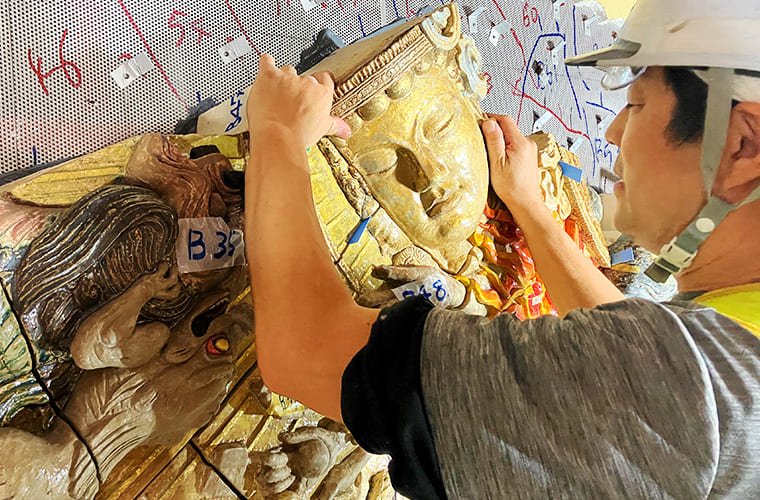 Installing each piece of the Ceramic Relief individually at the site