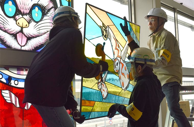 Installing the completed Stained Glass artwork at the site