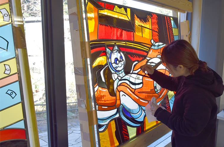 Cleaning and polishing the completed Stained Glass in natural light