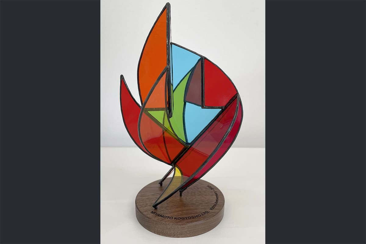 A glass object created to commemorate a company anniversary
