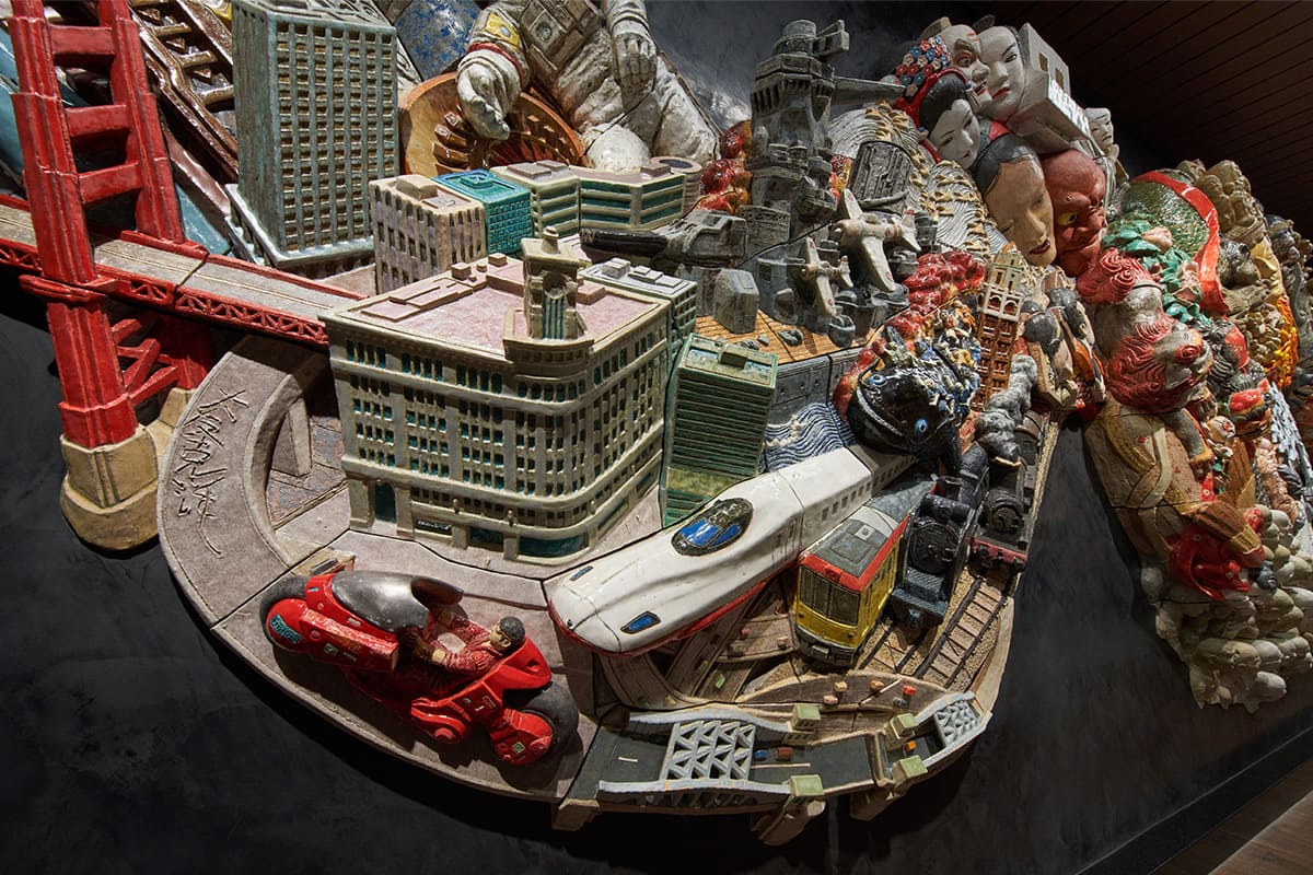 Close-up of the left section of the Ceramic Relief “Procession Spin” installed at Tokyo Metro Ginza Station